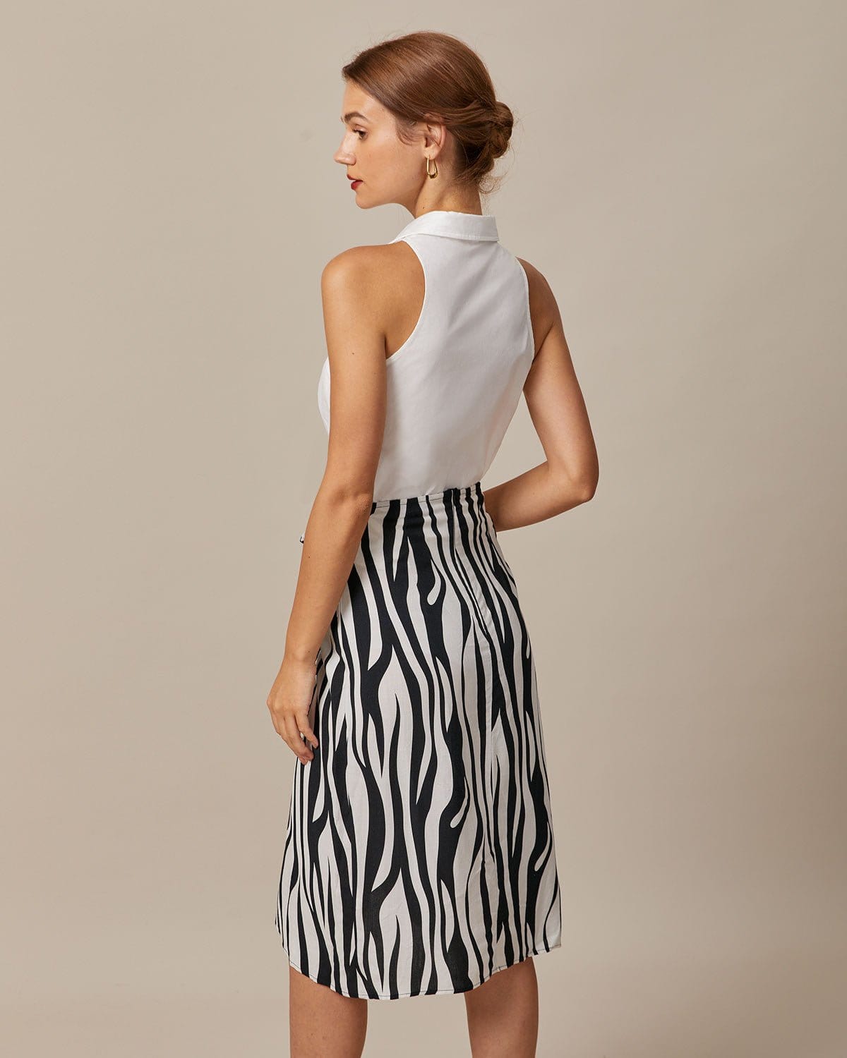 Ella Paris™ | La chemise blanche sans manches à col et à boutons